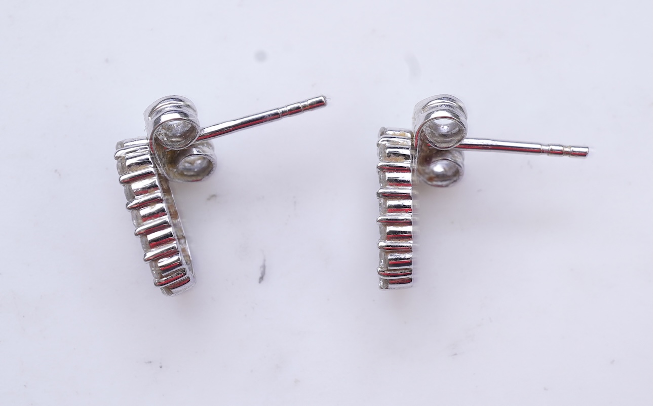 A diamond pendant and pair of diamond stud earrings